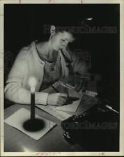 1971 Press Photo Donna Miller, Welfare Employee Working by Candlelight in Texas picture