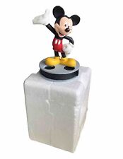 Vintage Mickey Mouse Figurine Standing on Movie Film Reel. Disney 1999 picture