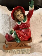 VERY CUTE FIGURINE OF A GIRL ON A SLED MADE OF PORCELAIN NWT picture