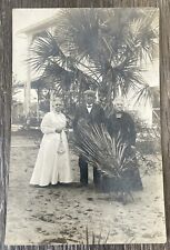 RPPC Three Older Well Dressed People Standing By Palm Trees picture