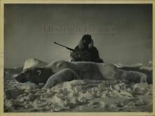 1965 Press Photo Hunter poses with rifle over polar bear - tua52972 picture