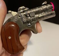 RARE VINTAGE  JI GUANG  CIGARETTE LIGHTER HAND GUN & LAZER POINTER BUTTERFLY picture