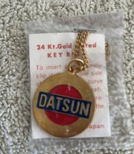 Datsun KEYCHAIN VINTAGE  24 KT gold plated RED BLUE ENAMEL JAPAN KEY CHAIN RING. picture