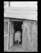 Mrs. Howard,lives in one-room cabin,Aitkin County,Minnesota,MN,September 1939,2 picture