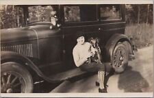 RPPC postcard Woman Posing With Puppy Dog On Antique Car 1931 picture