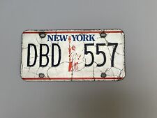VINTAGE NEW YORK STATE LICENSE PLATE TAG STATUE OF LIBERTY DBD 557 WHITE BLUE picture