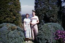 35mm Slide 1950s Red Border Kodachrome Man and Woman in Rose Garden picture
