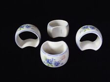 Nikko Tableware Napkin rings/Holders, Set of 4. Floral pattern with blue edges. picture