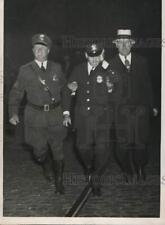 1934 Press Photo Injured Policeman Ushered Away From Street Car Strike Violence picture