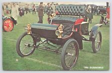 1902 Oldsmobile~Red & Black~Open Wheels~@ Grassy Car Show~People Admiring~Vtg PC picture