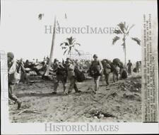 1952 Press Photo American reinforcements carry supplies on Guadalcanal Island picture