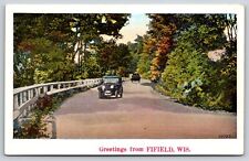 Fifield Wisconsin~Greetings~Classic Cars On Scenic Highway~Vintage Postcard picture