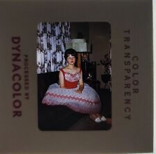 1960s Slide pretty woman in red and white dress sitting indoors picture