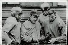 1952 Press Photo Michigan State Coach Biggie Muna and others look at shoe picture