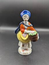 Occupied Japan Vintage figurine Lady holding basket of Flowers picture