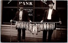 Fishing For A Loan Fish Tied On Rope Men Outside the Bank Building Postcard picture