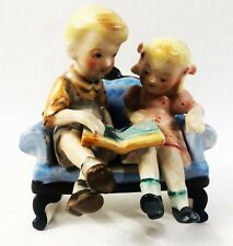 1950s Nippon Yoko Boeki Co. Boy and Girl on Sofa With Book Porcelain Figurine picture