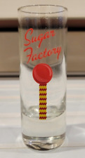 CLEAR SHOT GLASS SUGAR FACTORY IN RED AND YELLOW 4 INCHES HOLDS 2 OZS picture