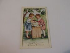 Birthday Postcard Young Girl and Boy mixing cake, lightly embossed picture