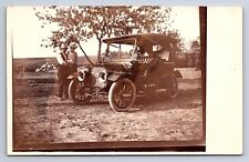 Postcard RPPC Two Men Admiring an early 1900s Car, Possibly a Rainier? picture