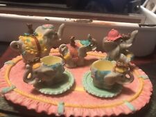 Set of 5 Minature Elephant Figurines with removable pieces on platters  picture