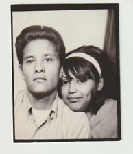 VINTAGE PHOTO BOOTH - YOUNG ATTRACTIVE, AFFECTIONATE HISPANIC COUPLE picture