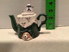 Mini teapot, dog under tea table, World Bazaar picture