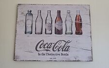 Coca-Cola Evolution Bottles Wood Sign by Sunbelt Gifts picture