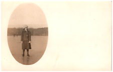 Postcard Vintage RPPC Woman Standing on a Frozen Lake picture