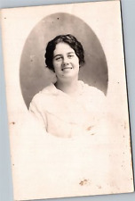 RPPC Smiling woman with brown hair in white outfit picture