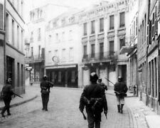 German Troops walk down a deserted street in Luxembourg 8x10 WWII Photo 838a picture