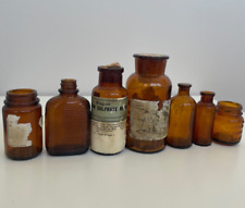 Lot 7 Antique Pharmacy Apothecary Amber Glass Bottles Merck Armstrong Vintage picture