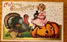 Antique Postcard Thanksgiving JOL Halloween Girl Sitting On Pumpkin Black Cat picture