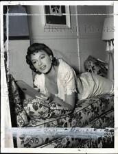 1956 Press Photo Actress Eva Bartok reading 