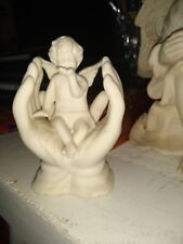 Ceramic Bisque Cherub Sitting in God's Hands Figurine Small Angel Blowing Kisses picture