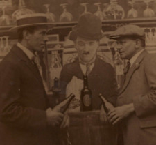 Men Drink Beer in Bottles with Charlie Chaplin Cardboard Standup RPPC Postcard picture