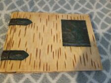 Vintage empty photo album wooden covers metal hinges and man on bucking horse picture