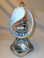 Rocky Shores Lighthouse In Sparkling Ornamental Egg - Music Box Ave Maria picture
