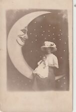 Vintage RPPC: ARCADE - BEAUTIFUL WOMAN IN HUGE FANCY HAT AND CHILD IN PAPER MOON picture