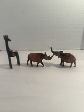 Small Wooden Handmade Animals.  Elephant, giraffe, rhinoceros picture