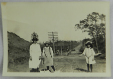Three Young Girls Walk Along Dirt Road During Construction - Vintage Photograph picture