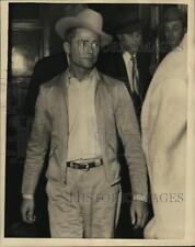 1952 Press Photo William Earl Malone walks from building - hcx49351 picture