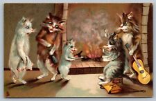 1910 postcard TUCK HUMOROUS CATS Series 122 fireplace/guitar/dead bird on plate picture