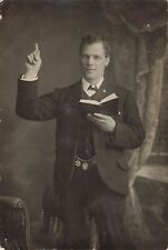 Vintage RPPC Young handsome Preacher Man Holding Bible Pointing to God Postcard picture