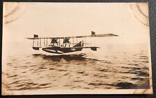 1920s RPPC Postcard of USN BIPLANE SWOOPS LOW OVER WATER picture