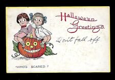 Early 1900's Gibson Halloween Postcard Children Sitting on a Pumpkin picture