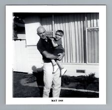 Vintage 1960s Man Holding Smiling Child Outside Home 3.5