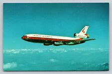 DC-10-30CF Jetliner Over Lake Tahoe World Airways Airline Issue Vintage Postcard picture