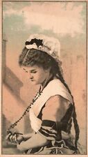 1880s-90s Woman In Dress with Cap Holding Beaded Necklace Cross Trade Card picture