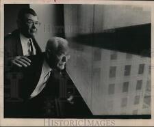 1964 Press Photo Commissioners Philip Sayers and Kyle Chapman at a window picture